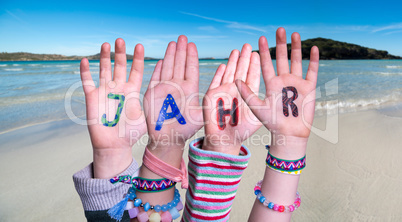 Children Hands Building Word Jahr Means Year, Ocean Background