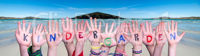Children Hands Building Word Kindergarden, Ocean Background