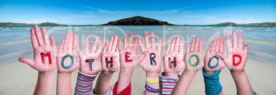 Children Hands Building Word Motherhood, Ocean Background
