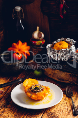 Filled pattypan squash on white plate