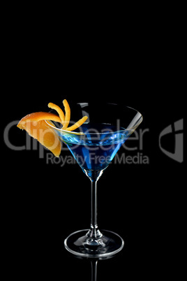 Orange decor Martini Blue Curacao on a black background