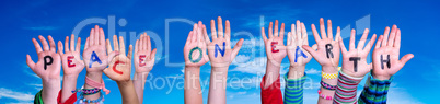 Children Hands Building Quote Peace On Earth, Blue Sky