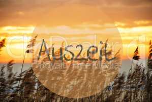 Beach Grass At Sunrise Or Sunset, Text Auszeit Means Downtime