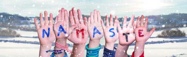 Children Hands Building Word Namaste Means Hello, Snowy Winter Background