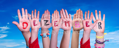 Children Hands Building Word Dezember Means December, Blue Sky