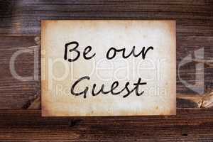 Old Paper, Text Be Our Guest, Wooden Background