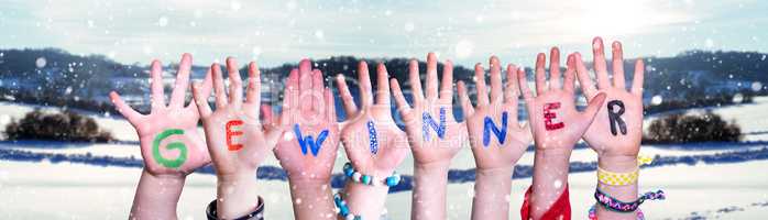 Children Hands Building Word Gewinner Means Winner, Snowy Winter Background