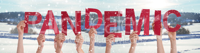People Hands Holding Word Pandemic, Snowy Winter Background