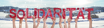 People Hands Holding Word Solidaritaet Means Solidarity, Snowy Winter Background