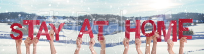 People Hands Holding Word Stay At Home, Snowy Winter Background