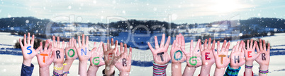 Children Hands Building Word Stronger Together, Snowy Winter Background