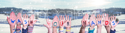 Kids Hands Holding Word Wash Your Hands, Snowy Winter Background
