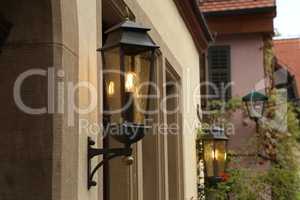 Old street lamps illuminate the way for passersby