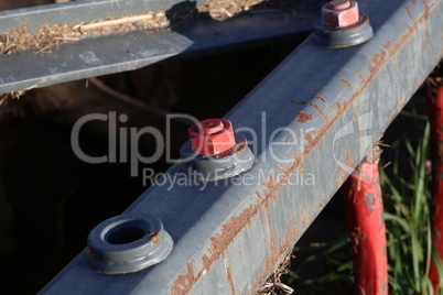 Detail of agricultural machinery fastened with bolts and nuts