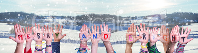 Children Hands Building Word Merry And Bright, Snowy Winter Background