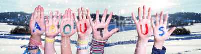 Children Hands Building Word About Us, Snowy Winter Background