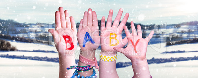 Children Hands Building Word Baby, Snowy Winter Background