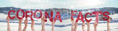 People Hands Holding Word Corona Facts, Snowy Winter Background