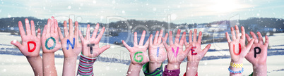 Kids Hands Holding Word Do Not Give Up, Snowy Winter Background
