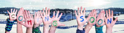 Children Hands Building Word Coming Soon, Snowy Winter Background