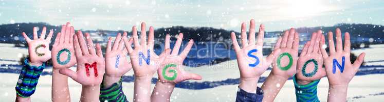 Children Hands Building Word Coming Soon, Snowy Winter Background