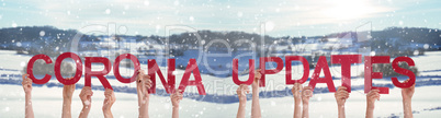 People Hands Holding Word Corona Updates, Snowy Winter Background