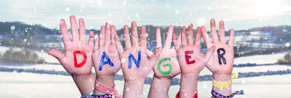 Children Hands Building Word Danger, Snowy Winter Background