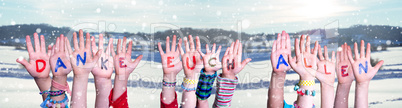 Kids Hands Holding Word Danke Euch Allen Means Thank You All, Snowy Background