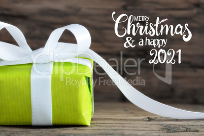 One Green Gift, White Bow, Wooden Background, Merry Christmas And A Happy 2021