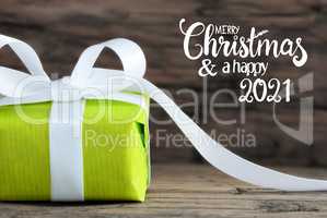 One Green Gift, White Bow, Wooden Background, Merry Christmas And A Happy 2021