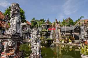 pond and sculptures in temple complex