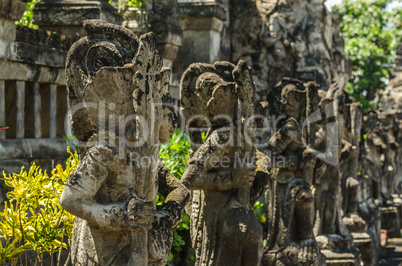many stone figures in temple complex