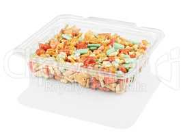 multicolored candy in a disposable plastic container