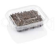 black pepper seeds in a transparent plastic container
