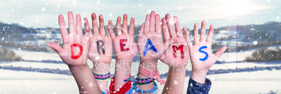 Children Hands Building Word Dreams, Snowy Winter Background