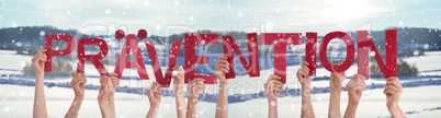 People Hands Holding Word Praevention Means Prevention, Snowy Winter Background