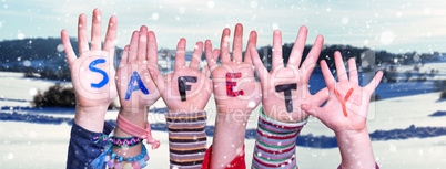 Children Hands Building Word Safety, Snowy Winter Background