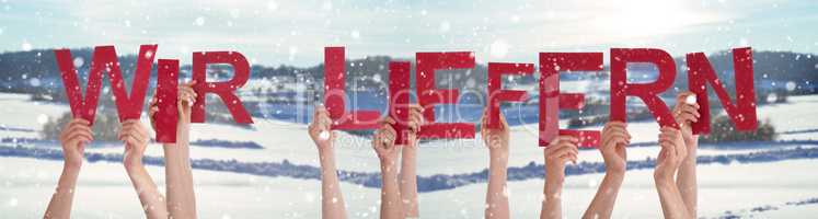 People Hands Holding Word Wir Liefern Means Delivery Service, Winter Background