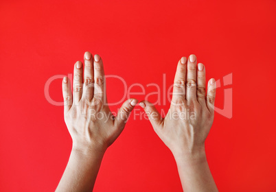 Female hands on red