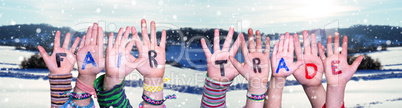 Children Hands Building Word Fair Trade, Snowy Winter Background