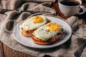 Toasts with vegetables and fried eggs with cup of coffee
