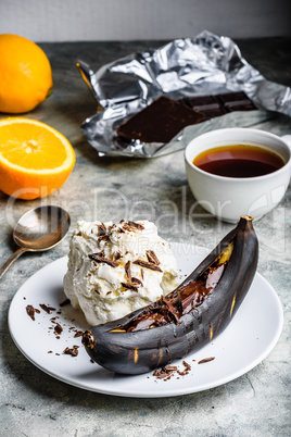 Grilled banana with dark chocolate and vanilla ice cream.