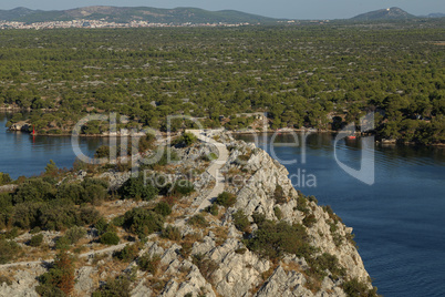 Walking path on the coast of the canal of St. Ante near Sibenik in Croatia