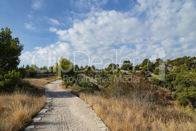 Walking path on the coast of the canal of St. Ante near Sibenik in Croatia