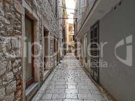 Tourist city by the Adratic sea - Sibenik, Croatia. The old stones, narrow street and stairs