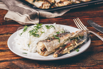 Baked hake carcasses with rice