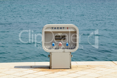 Charging station for boats, electrical outlets to charge ships in harbor