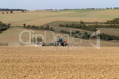 Tractor at agricultural work in the field