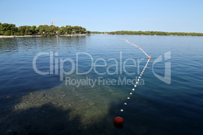 rope with buoys to fence off a safe swimming area on the beach