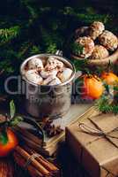 Metal mug of hot chocolate with marshmallows